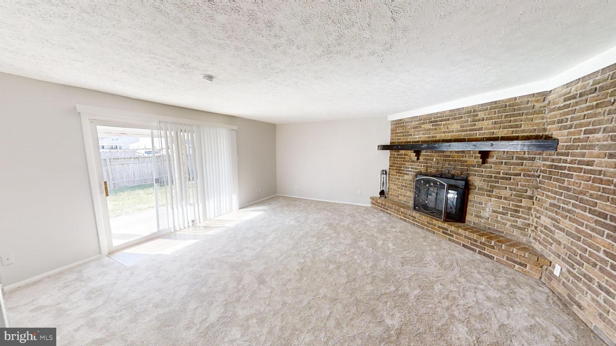 150 Dunlap Road Pasadena, MD 21122 - Photo 12 of 24 a view of empty room with a fireplace