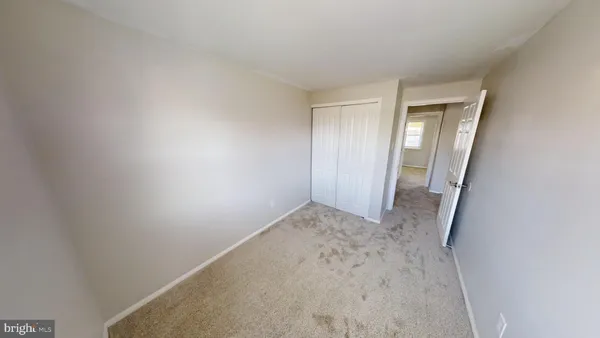 a view of hallway with closet