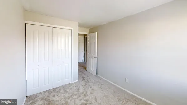 a view of hallway with closet