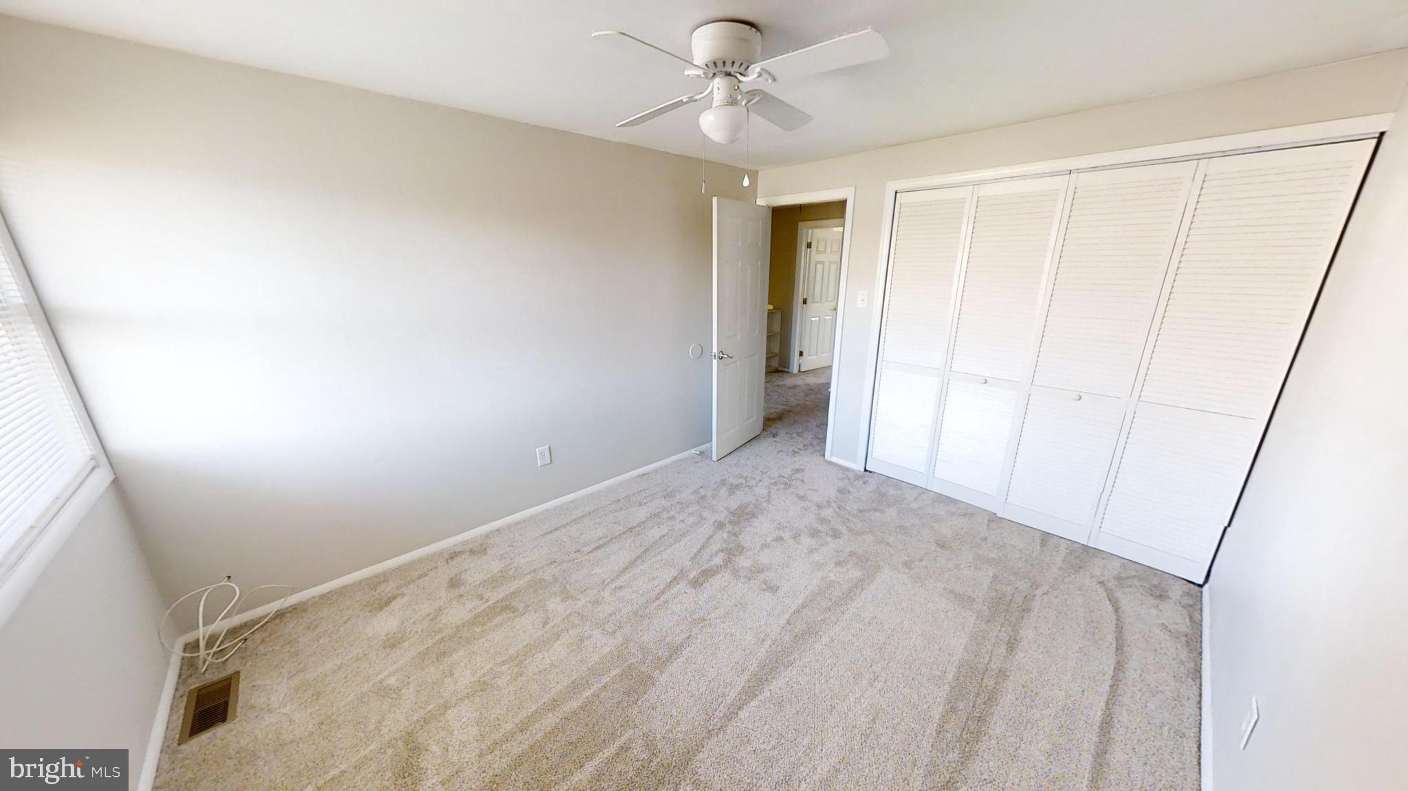 150 Dunlap Road Pasadena, MD 21122 - Photo 21 of 24 wooden floor in an empty room with a window