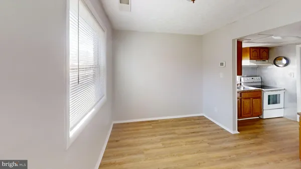 a view of a kitchen cabinets and wooden floor