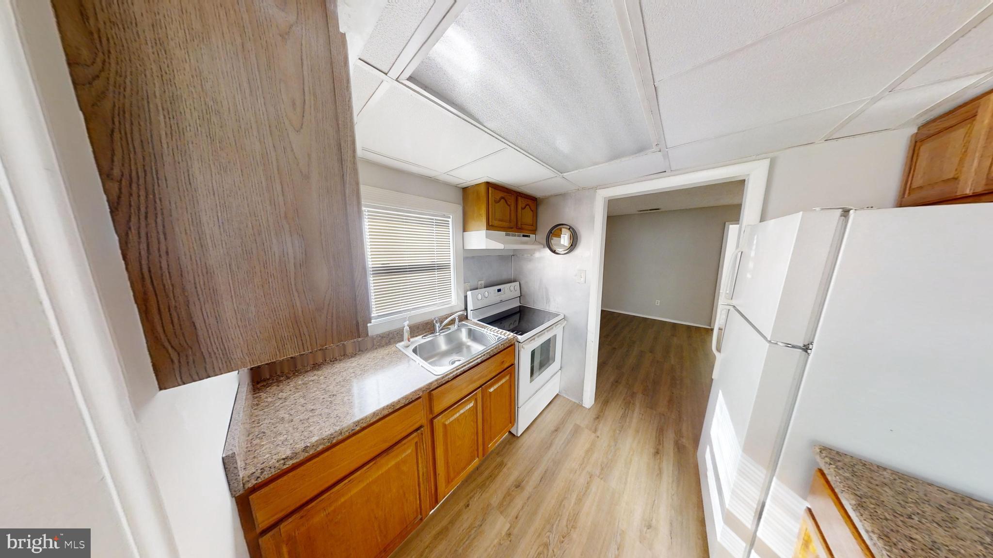 150 Dunlap Road Pasadena, MD 21122 - Photo 6 of 24 a bed room with a bed and a television