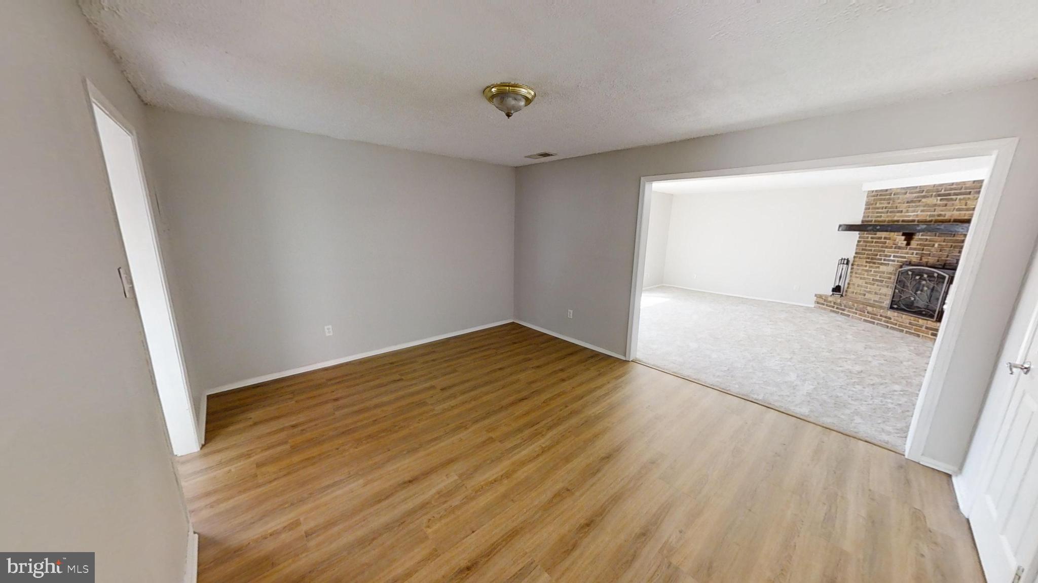 150 Dunlap Road Pasadena, MD 21122 - Photo 8 of 24 wooden floor in an empty room