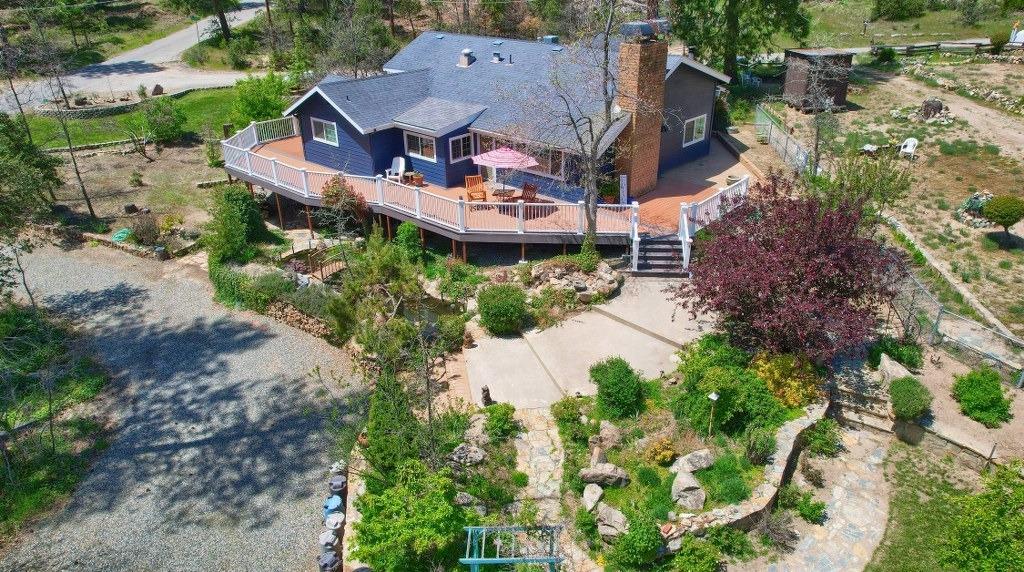 50537 Cedar Valley Drive Oakhurst, CA 93644 - Photo 1 of 59 an aerial view of a house with garden space and a patio