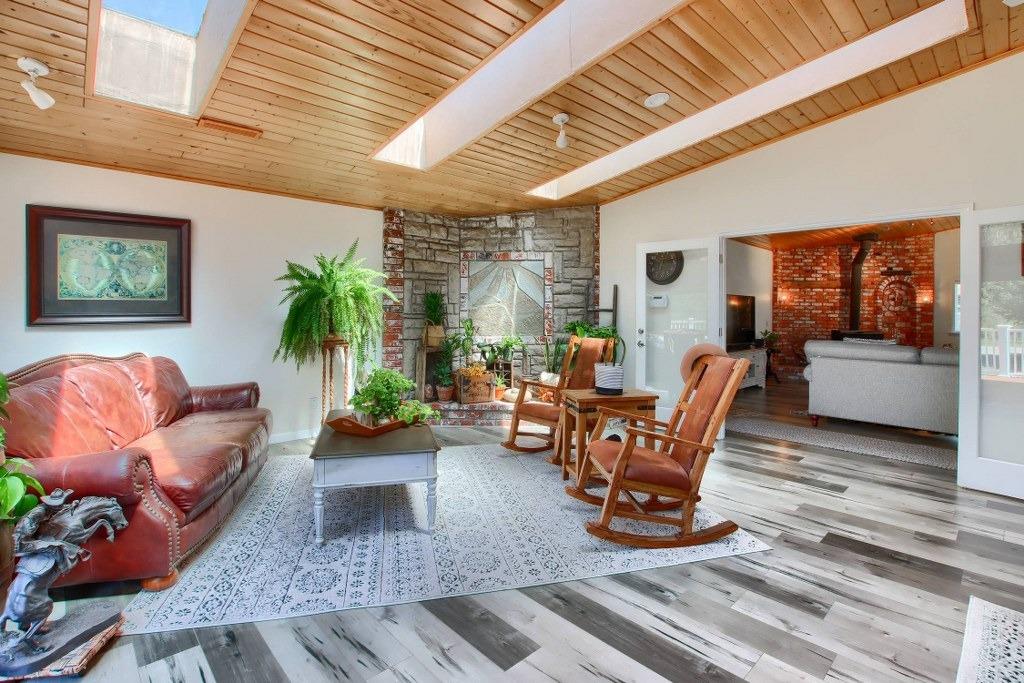 50537 Cedar Valley Drive Oakhurst, CA 93644 - Photo 15 of 59 a living room with furniture and a large window