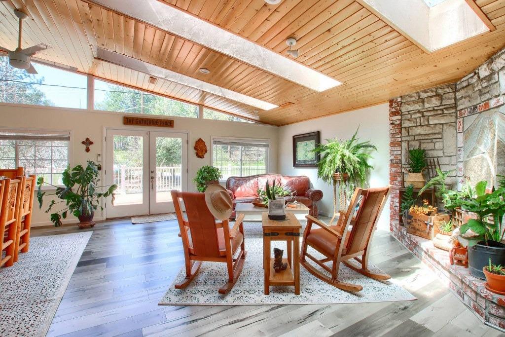 50537 Cedar Valley Drive Oakhurst, CA 93644 - Photo 16 of 59 a view of an outside dining space with furniture