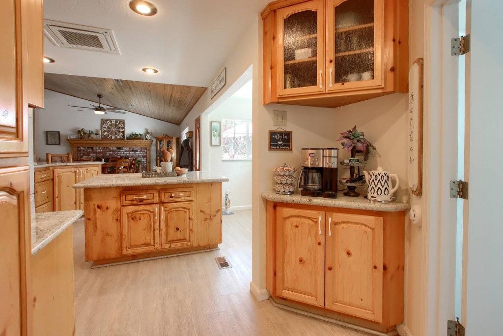 50537 Cedar Valley Drive Oakhurst, CA 93644 - Photo 20 of 59 a kitchen with stainless steel appliances granite countertop a sink and cabinets
