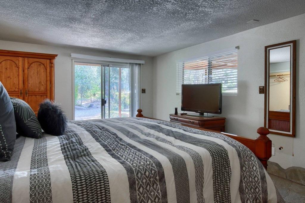 50537 Cedar Valley Drive Oakhurst, CA 93644 - Photo 29 of 59 a bedroom with a bed and a television