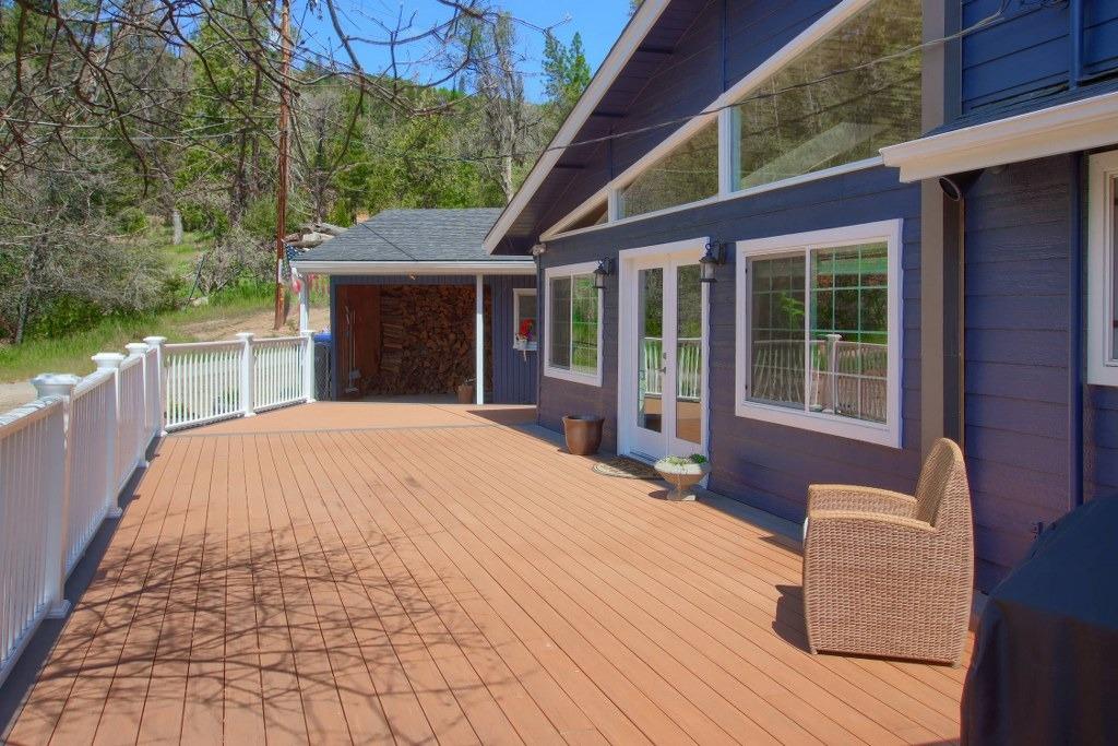 50537 Cedar Valley Drive Oakhurst, CA 93644 - Photo 40 of 59 a view of a house with backyard and porch