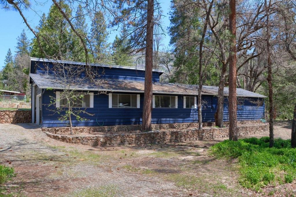 50537 Cedar Valley Drive Oakhurst, CA 93644 - Photo 49 of 59 front view of a house with a yard