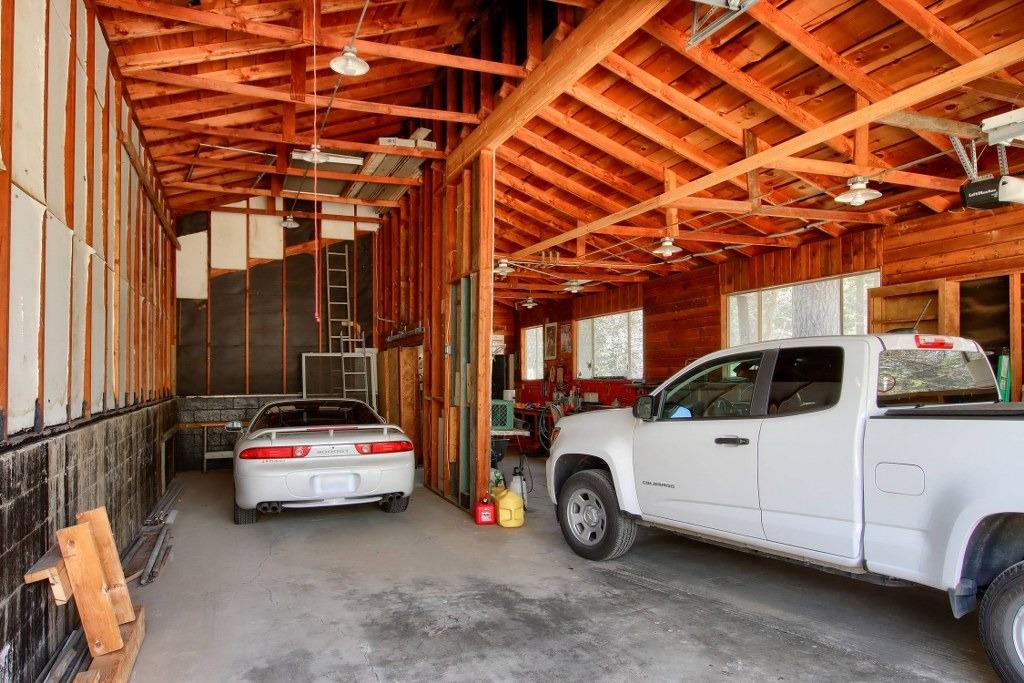 50537 Cedar Valley Drive Oakhurst, CA 93644 - Photo 52 of 59 a view of parking garage with cars parked