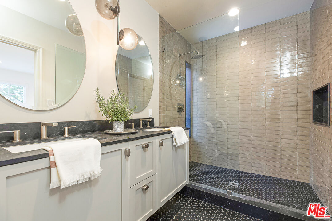 1411 Wellesley Drive Glendale, CA 91205 - Photo 14 of 32 a bathroom with a double vanity sink mirror and shower