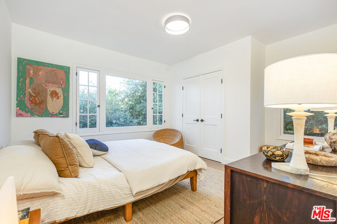 1411 Wellesley Drive Glendale, CA 91205 - Photo 15 of 32 a bedroom with a bed and wooden floor