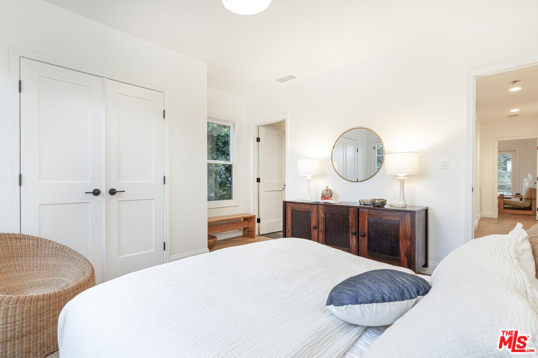 1411 Wellesley Drive Glendale, CA 91205 - Photo 16 of 32 a bed room with a bed a mirror and a table