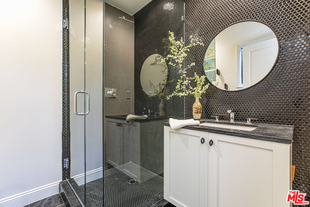 1411 Wellesley Drive Glendale, CA 91205 - Photo 17 of 32 a bathroom with a sink and a mirror