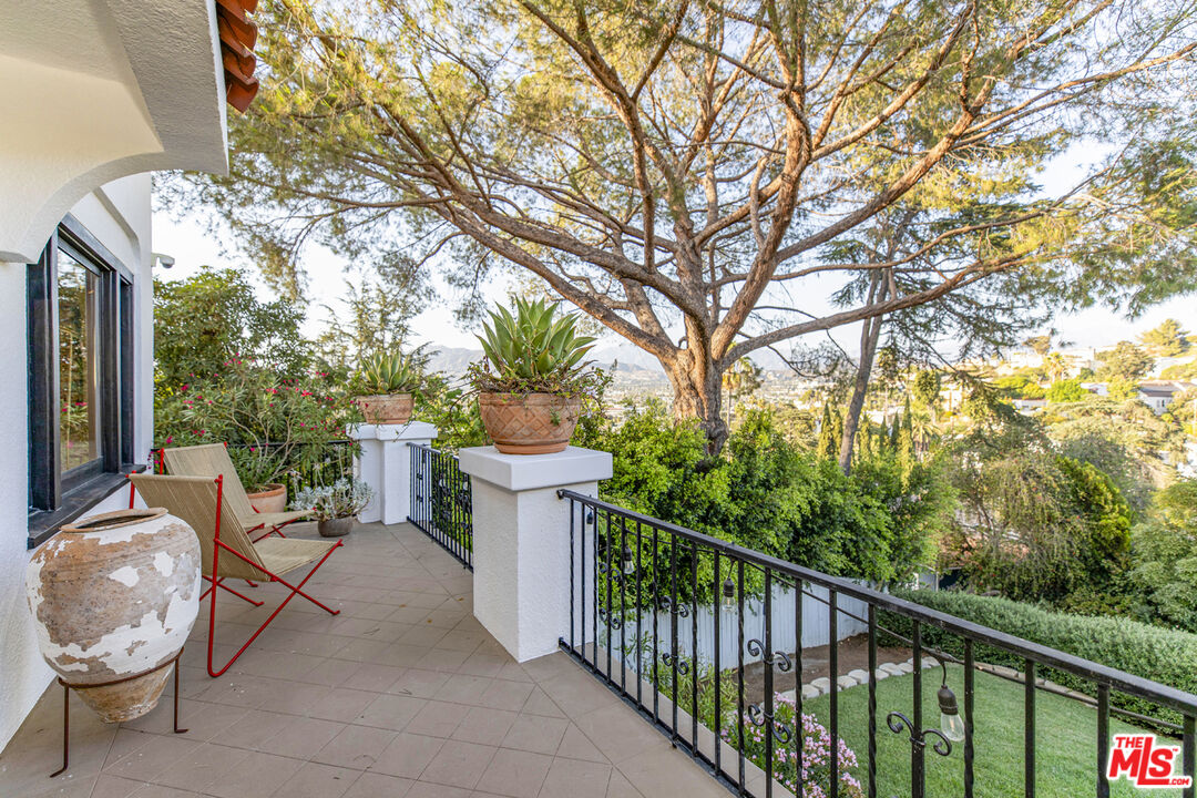 1411 Wellesley Drive Glendale, CA 91205 - Photo 2 of 32 a view of a chair and tables in the balcony