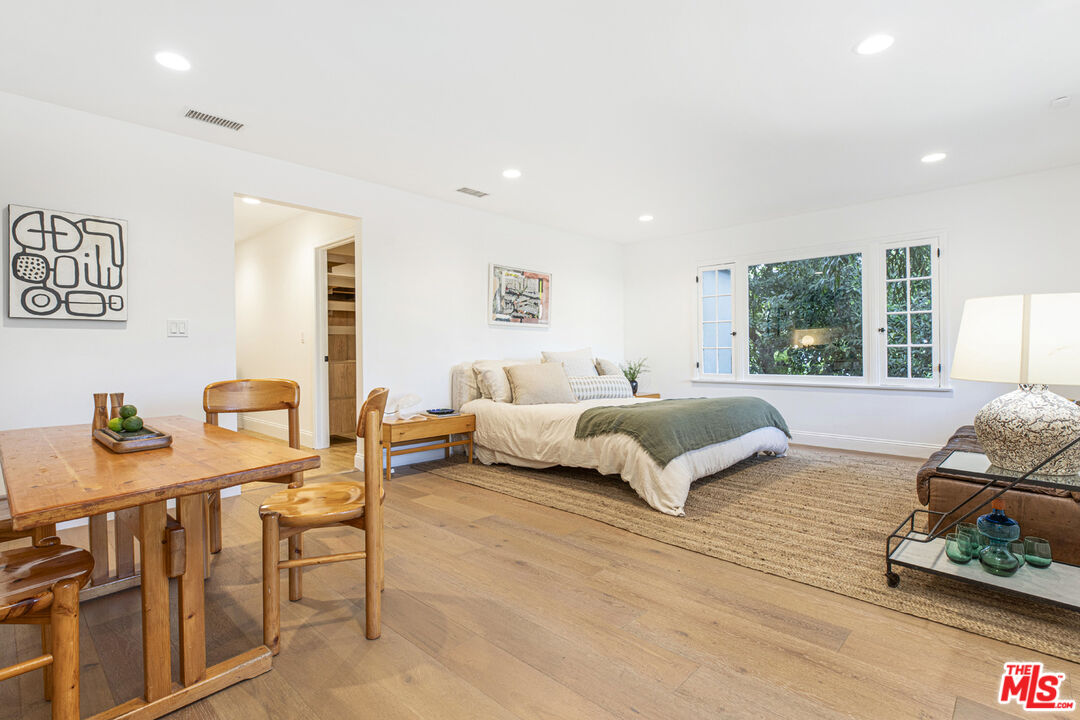 1411 Wellesley Drive Glendale, CA 91205 - Photo 21 of 32 a bedroom with a bed window and couch