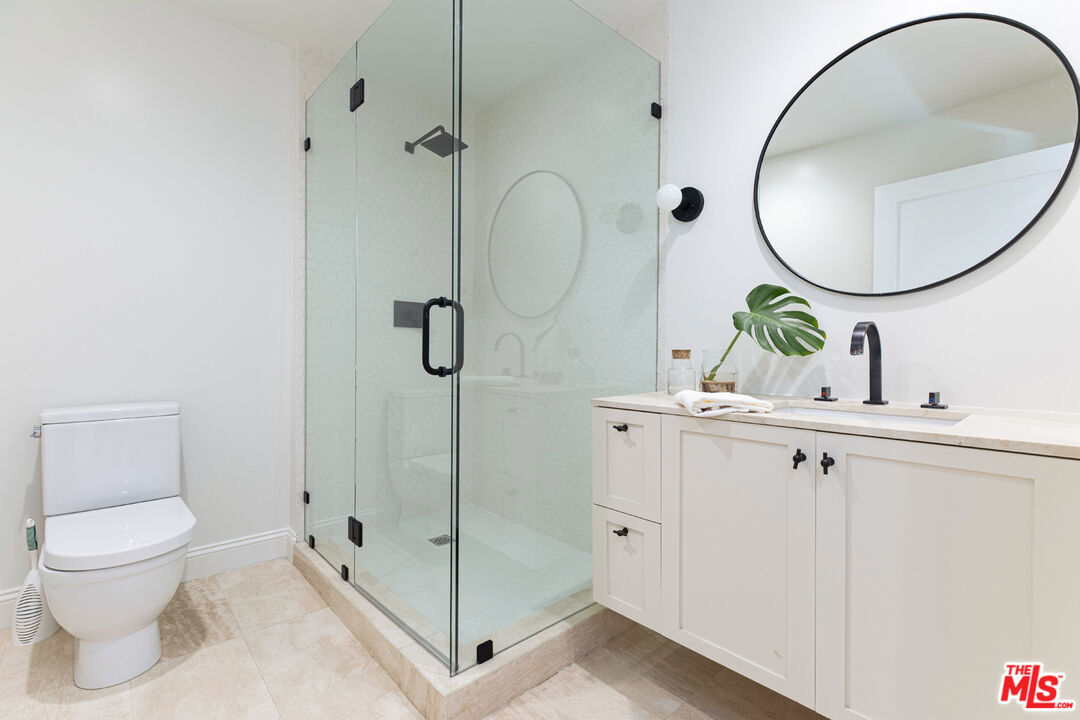 1411 Wellesley Drive Glendale, CA 91205 - Photo 24 of 32 a bathroom with a toilet a sink and a mirror