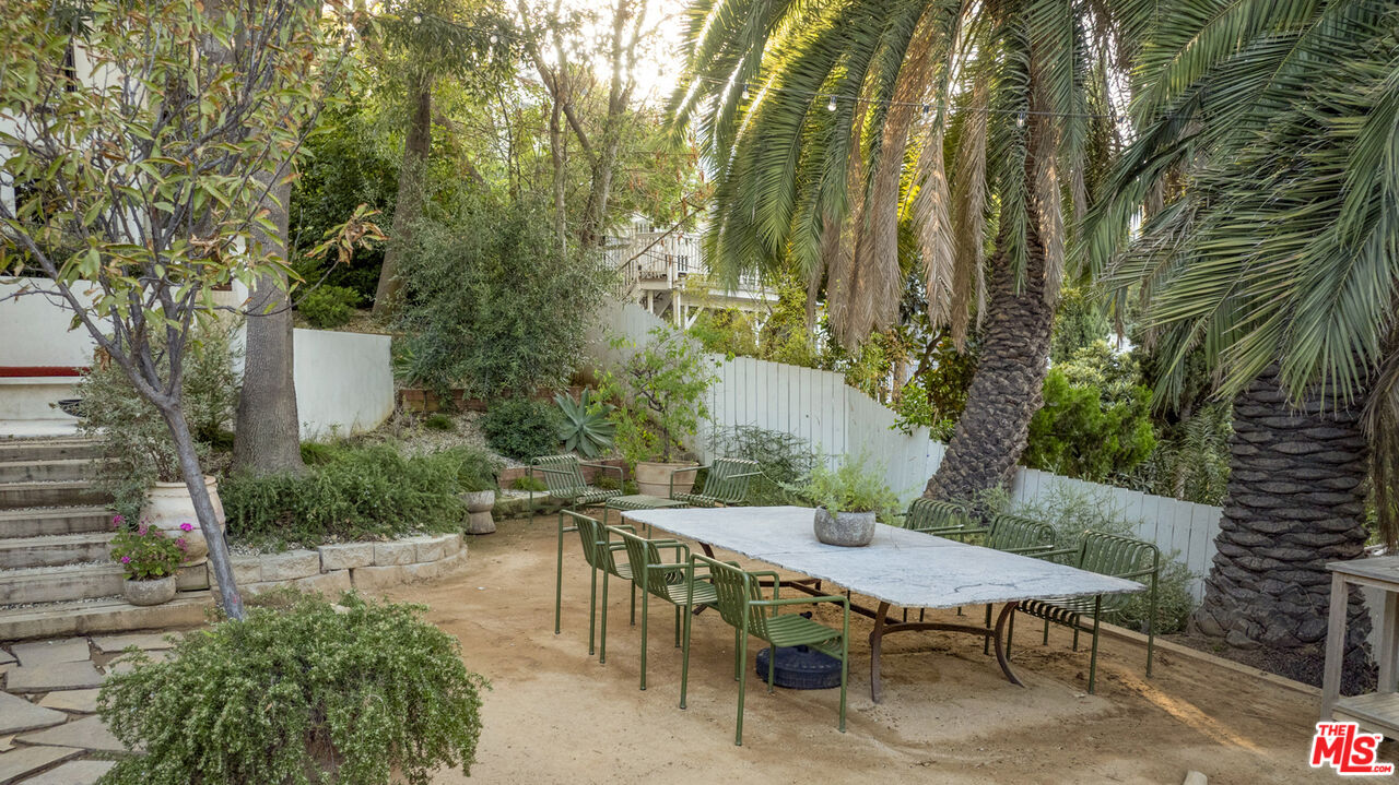 1411 Wellesley Drive Glendale, CA 91205 - Photo 26 of 32 a view of a backyard with table and chairs and a fire pit