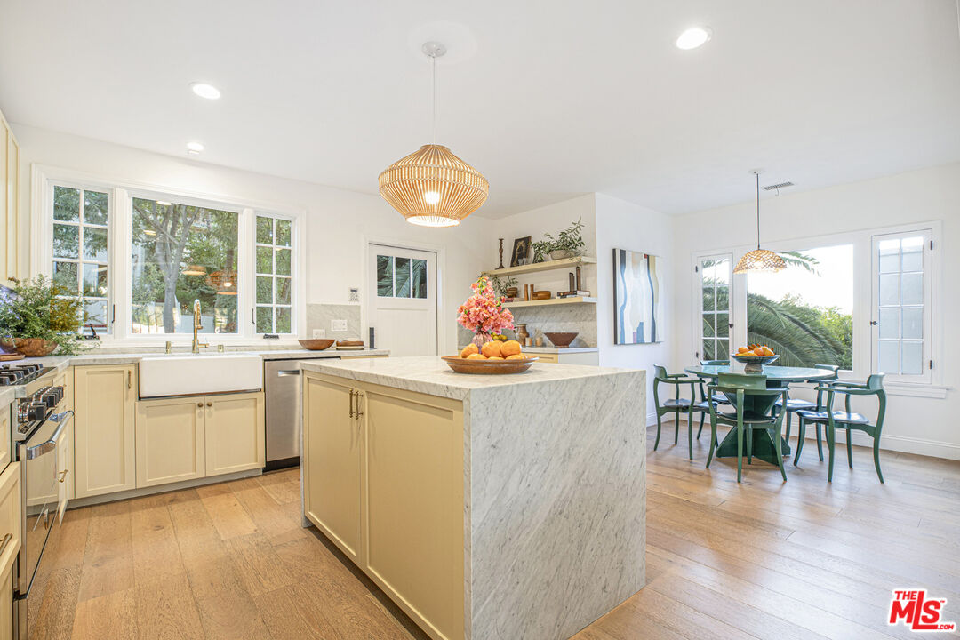 1411 Wellesley Drive Glendale, CA 91205 - Photo 10 of 32 a living room with granite countertop furniture a dining table wooden floor and a large window