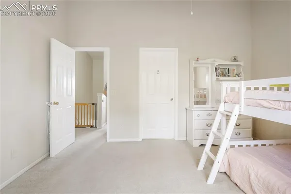 a view of a livingroom with wooden floor and white walls