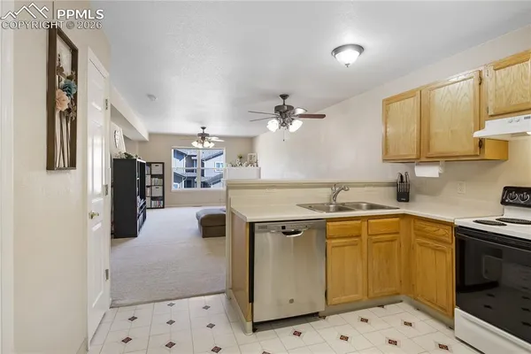 a kitchen with a sink cabinets and window