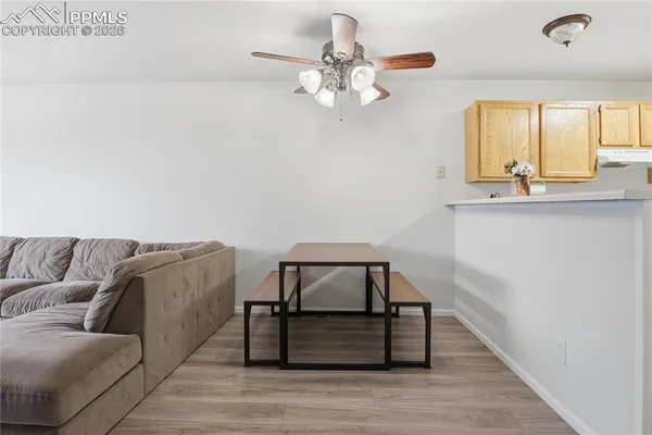a living room with a couch and chandelier