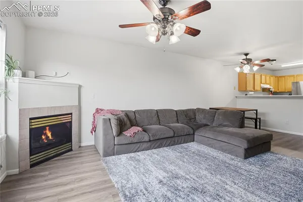 a living room with furniture and a fireplace