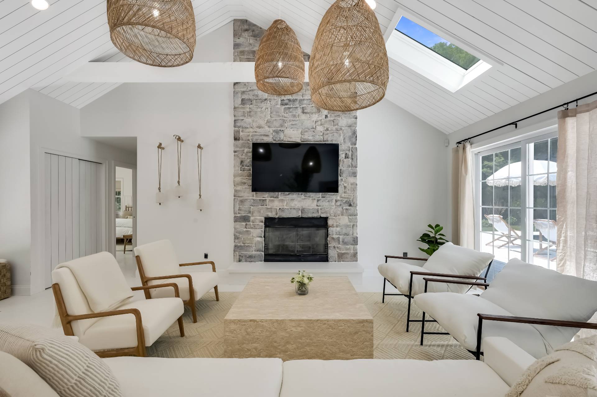 80 Beckys Path Bridgehampton, NY 11932 - Photo 6 of 13 a living room with furniture a fireplace and a large window