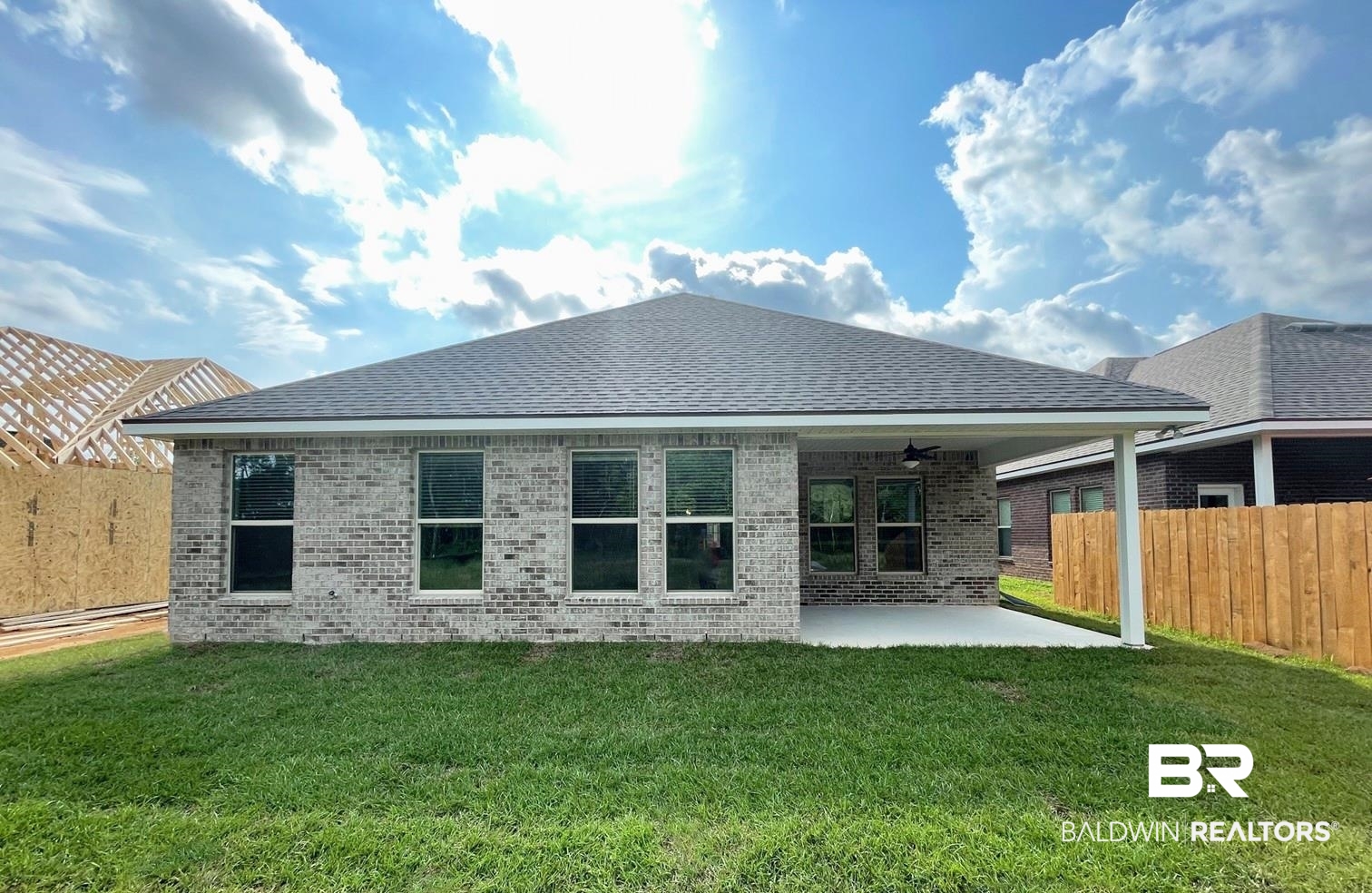 1424 Fenton Circle Foley, AL 36535 - Photo 18 of 20 Back of property with a patio area, a lawn, and ceiling fan