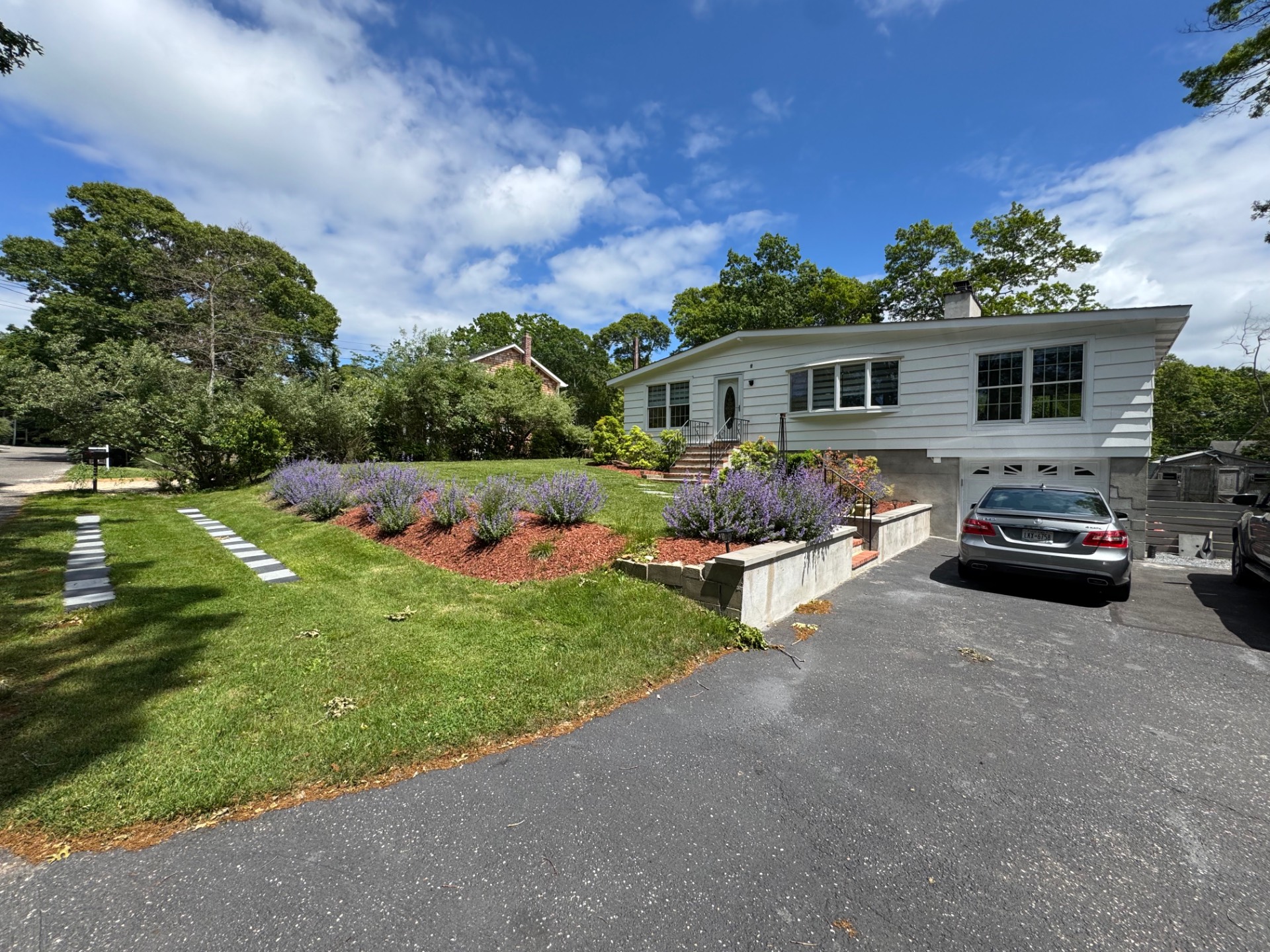 16 Fern Road Southampton, NY 11968 - Photo 1 of 9 a front view of a house with garden