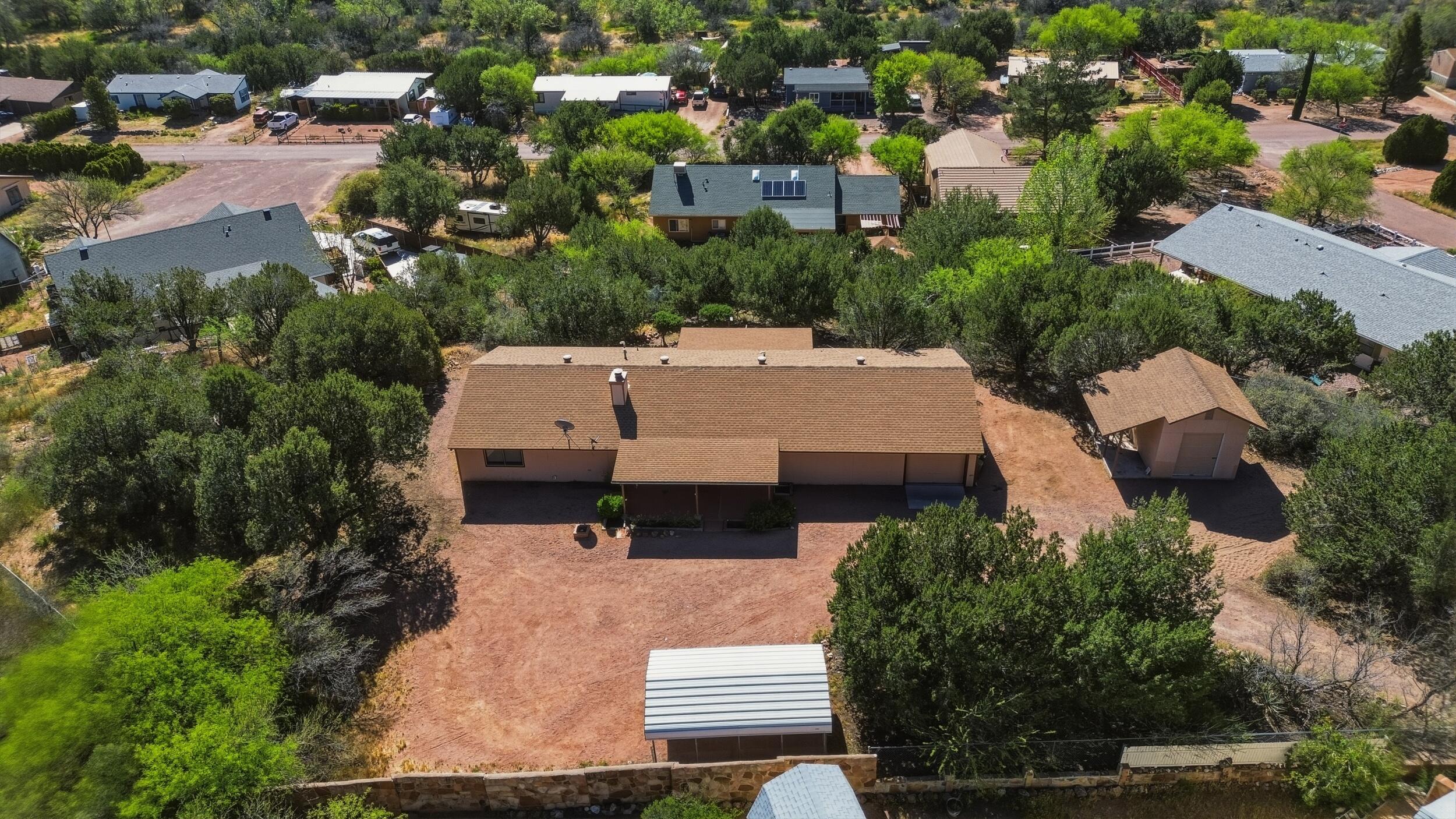 198 Lucky Lane Payson, AZ 85541 - Photo 27 of 31 an aerial view of a house with yard and parking spaces