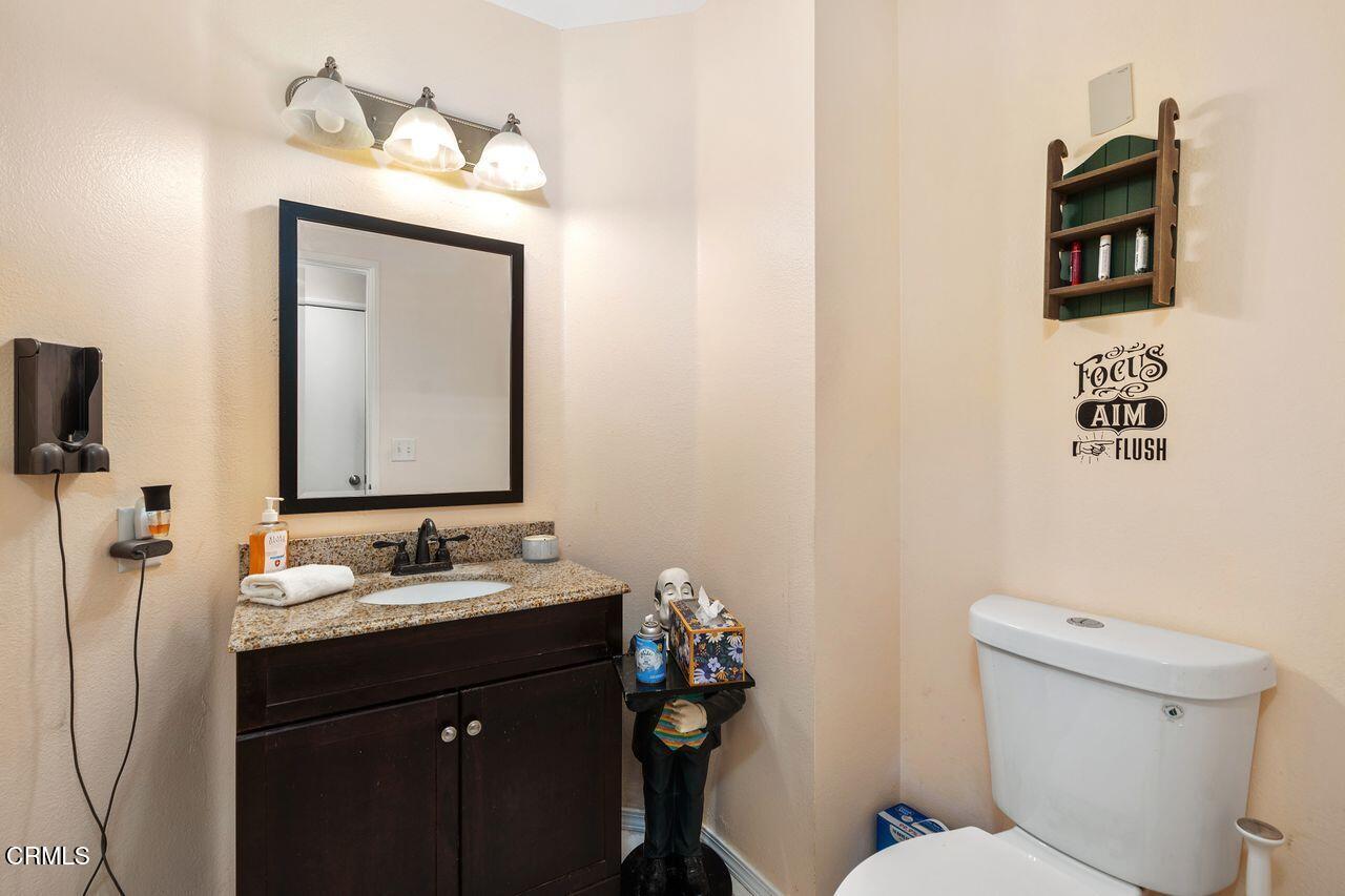 807 Kingfisher Way Oxnard, CA 93030 - Photo 13 of 45 a bathroom with a toilet sink and mirror