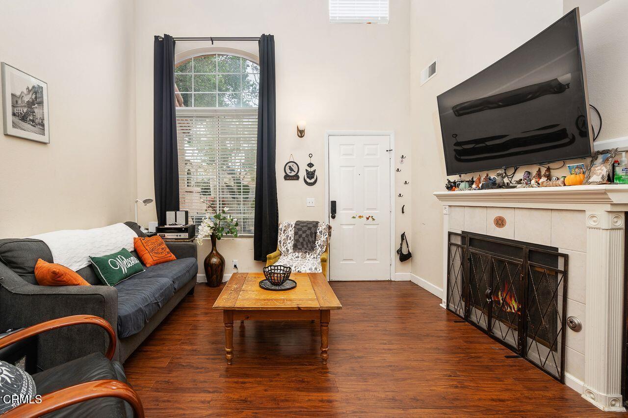 807 Kingfisher Way Oxnard, CA 93030 - Photo 29 of 45 a living room with furniture a fireplace and a flat screen tv