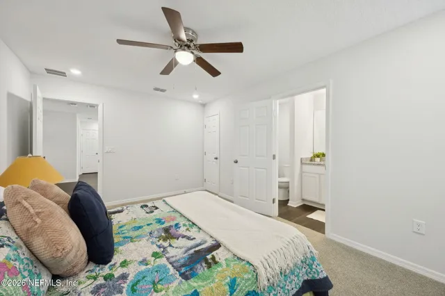 a bedroom with a bed and furniture