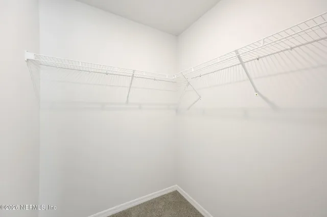 a view of a room with racks on the wall