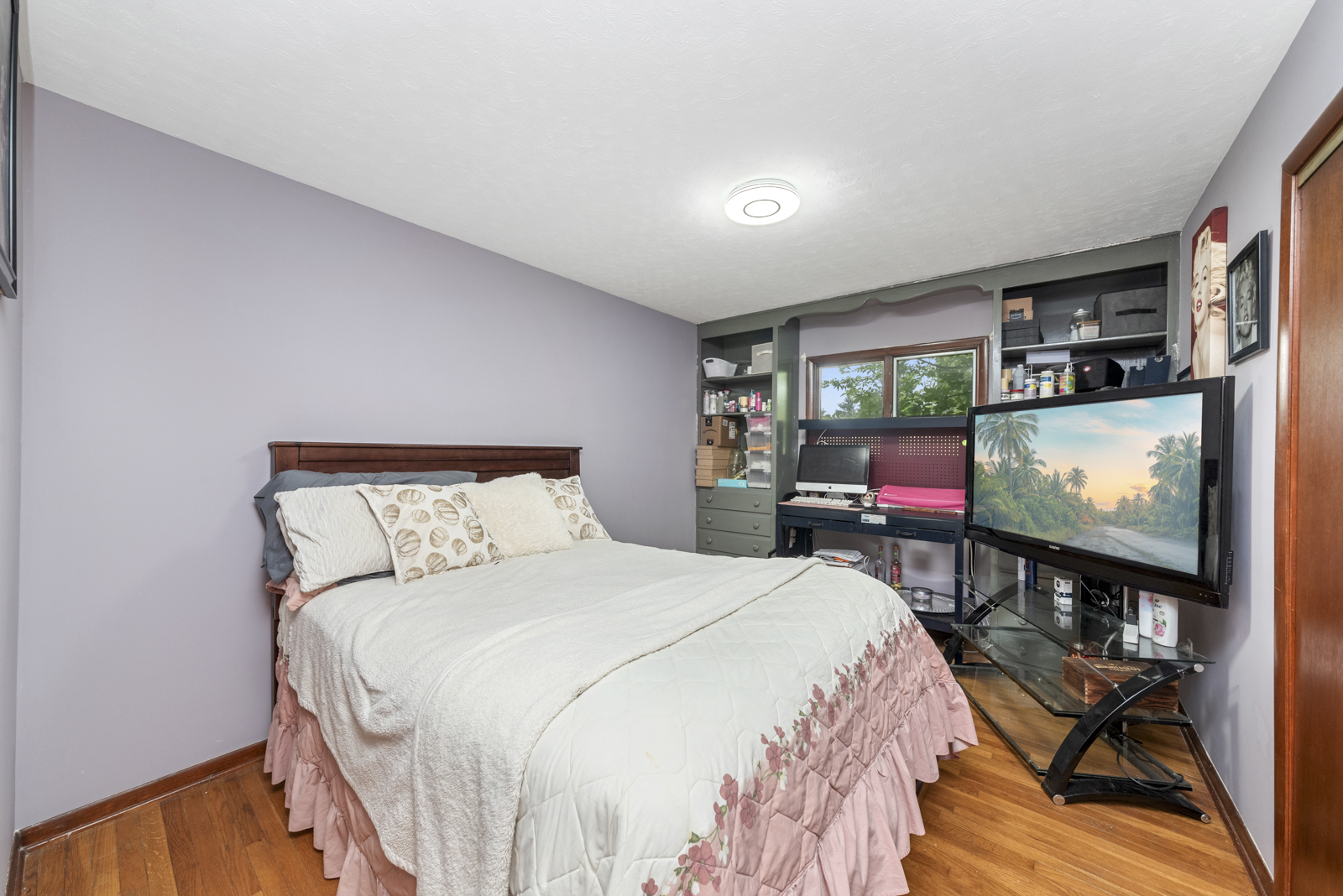 23949 West McClintock Road Channahon, IL 60410 - Photo 12 of 21 a bedroom with a bed tv on table and a large window