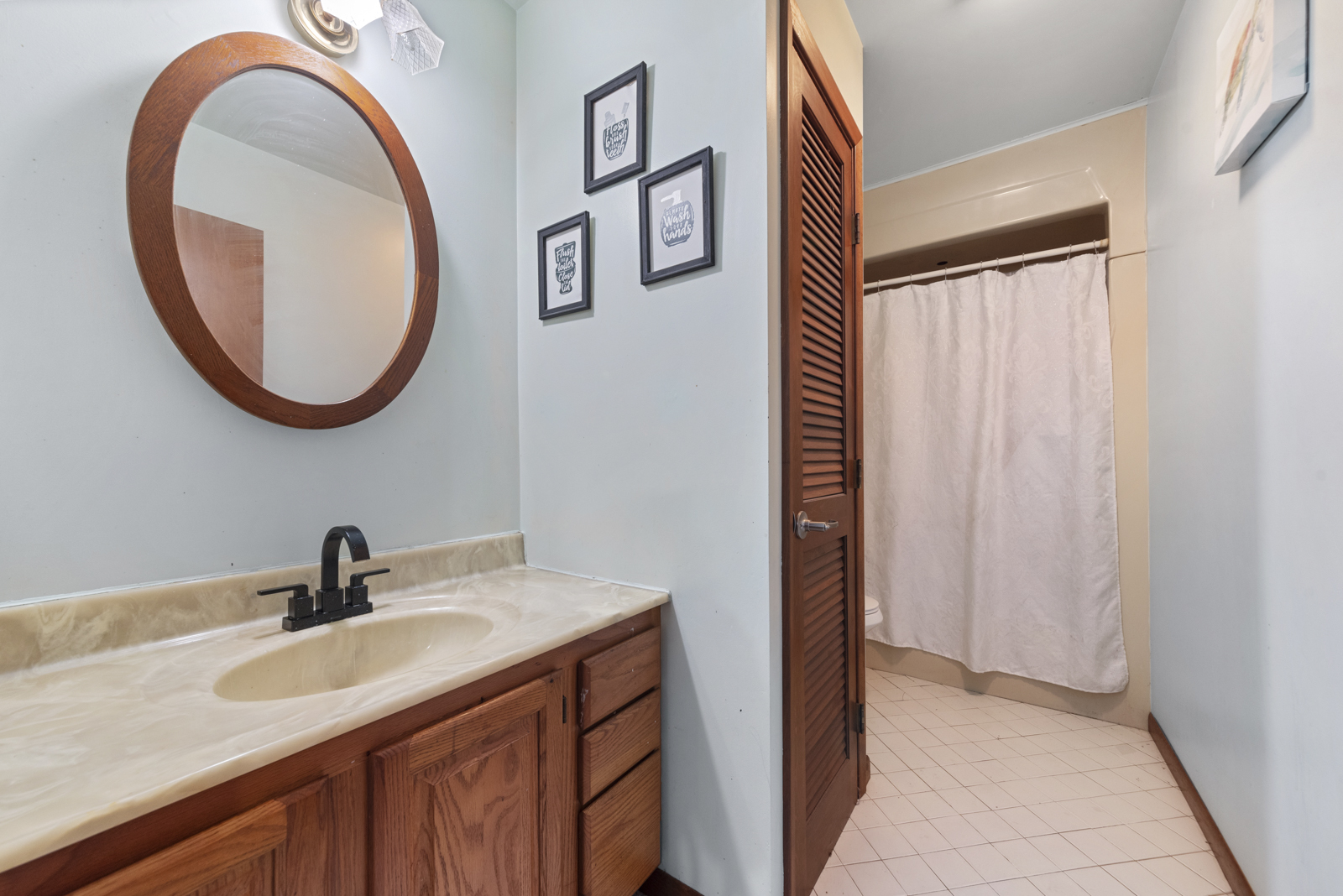 23949 West McClintock Road Channahon, IL 60410 - Photo 14 of 21 a bathroom with a sink and a mirror