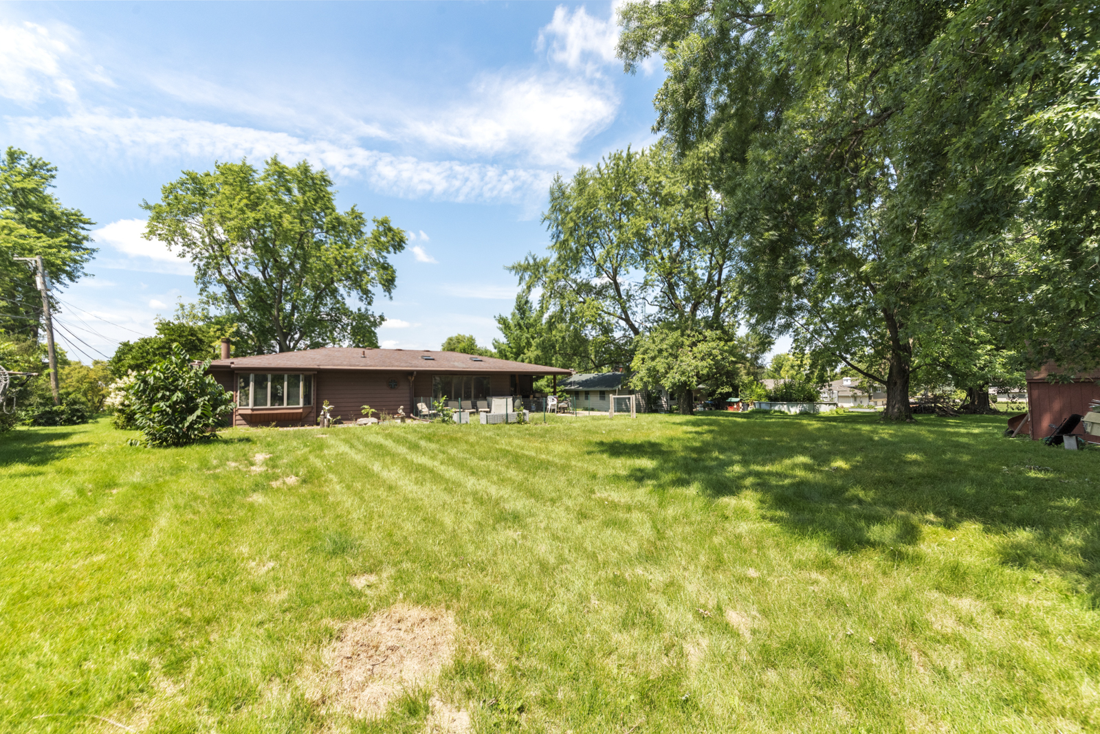 23949 West McClintock Road Channahon, IL 60410 - Photo 21 of 21 a backyard of a house with plants and large tree