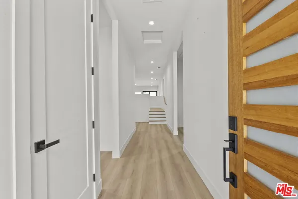 a view of a bathroom from a hallway