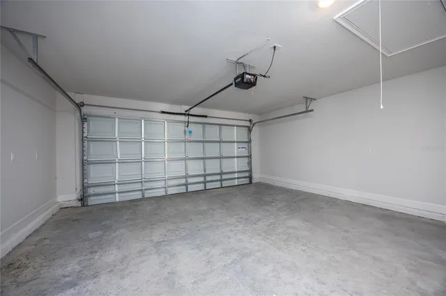 a view of walk in closet with wooden floor and a window