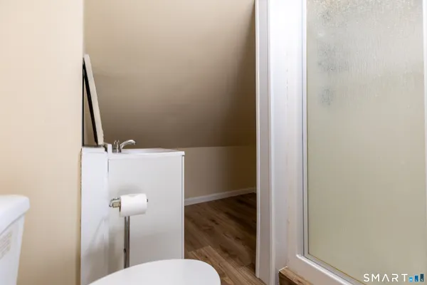 a bathroom with a sink and toilet