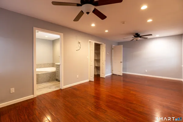 a view of an empty room and a window