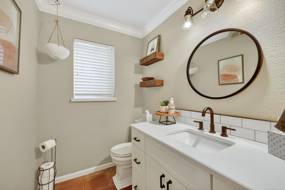 3340 Garden Bar Road Lincoln, CA 95648 - Photo 22 of 56 a bathroom with a toilet sink and mirror