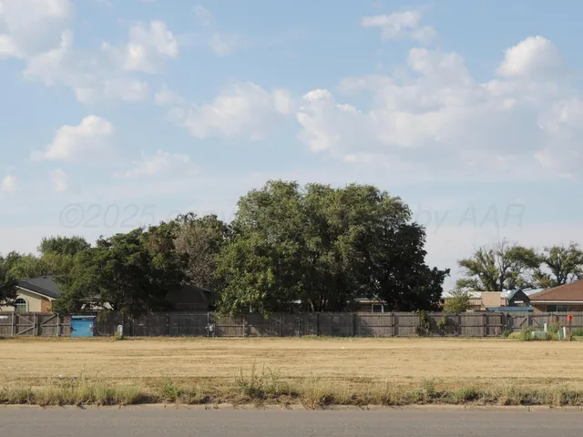 a view of a swimming pool with an outdoor seating