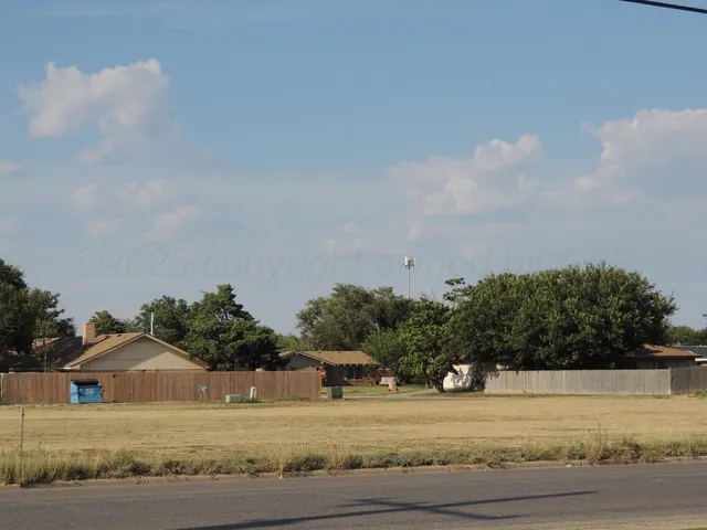 a view of a yard with an outdoor space