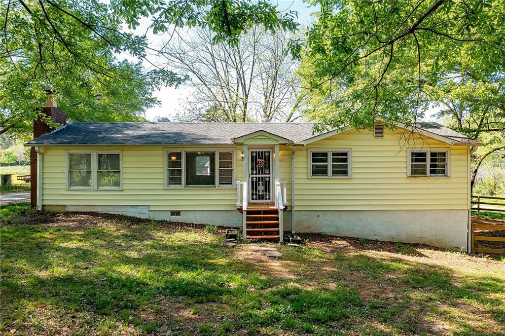 13193 Fincher Road Canton, GA 30114 - Photo 1 of 1 a view of a house with a yard