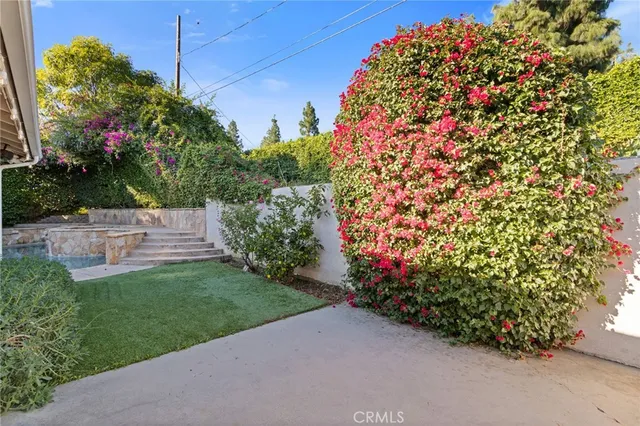 an aerial view of a house with a garden