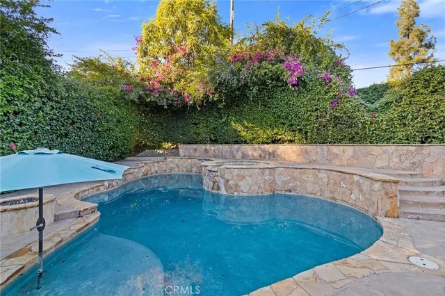 an aerial view of residential houses with yard