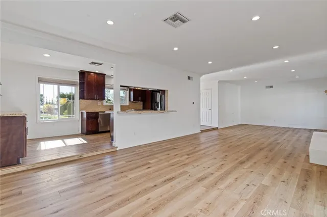 a kitchen with granite countertop a stove and a sink